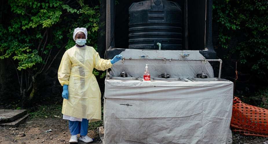 A health worker oversees temperature checks and hand washing at Kyeshero Hospital in Goma on Monday as authorities step up Ebola prevention measures following reports of a case in the eastern DR Congo city. - AFP - JOSPIN MWISHA