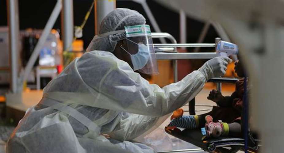 Health workers wearing personal protective gear at the Ga East District Hospital, working tirelessly day and night to save lives.Photo: Rodney Quarcoo, World Bank