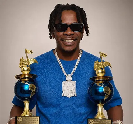 Shatta Wale displaying his awards