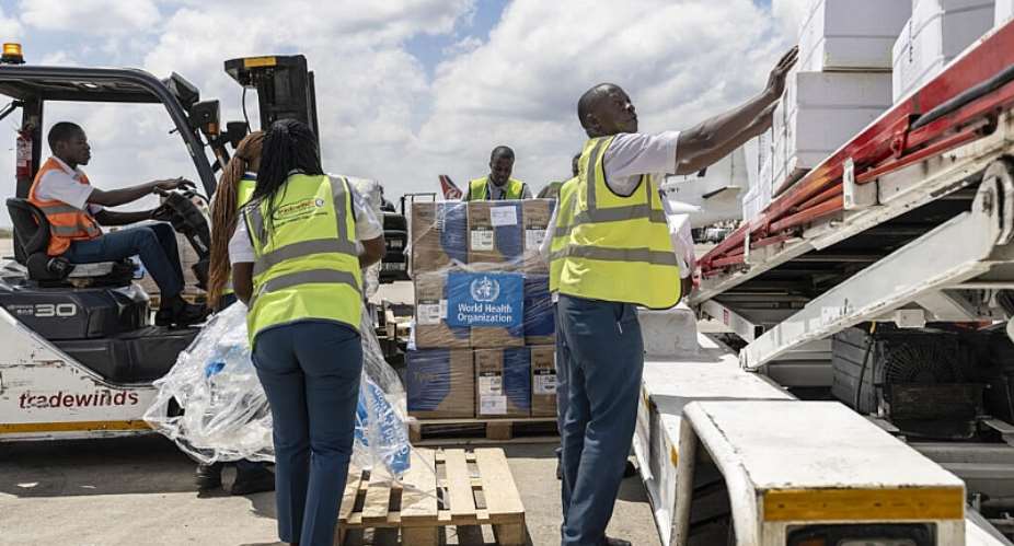 Ground crew load medical supplies onto a UN-operated charter plane bound for Bunia in eastern Democratic Republic of Congo as the World Health Organization (WHO) response to the latest deadly Ebola outbreak. -  Tony KARUMBA / AFP