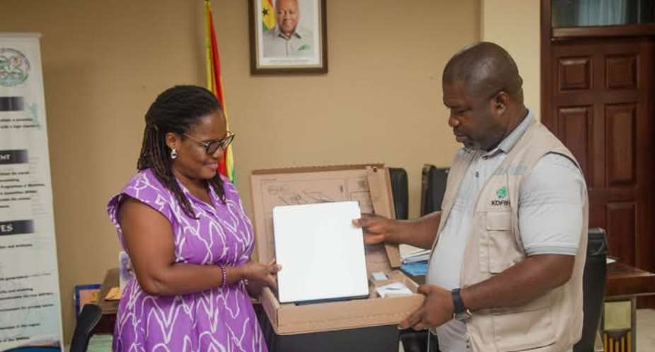 Madam Stella Kudah, Country Director of Friends of Adaklu, presenting a Starlink internet device to the Volta Regional Minister, Hon.James Gunu at his office in Ho.