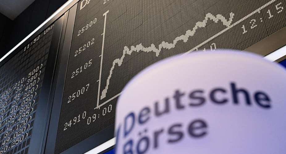 A board displays the chart of Germanys share index DAX at the stock exchange in Frankfurt am Main, western Germany, on January 19, 2026. -  AFP, Kirill Kudryavtse