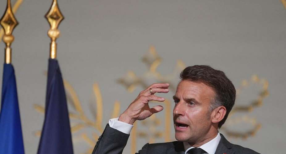 Frances President Emmanuel Macron gestures as he delivers a speech during a ceremony marking the 25th anniversary of the law recognising the slave trade and slavery as crimes against humanity at the Elysee Palace in Paris on May 21, 2026. -  Thibault Camus, AFP