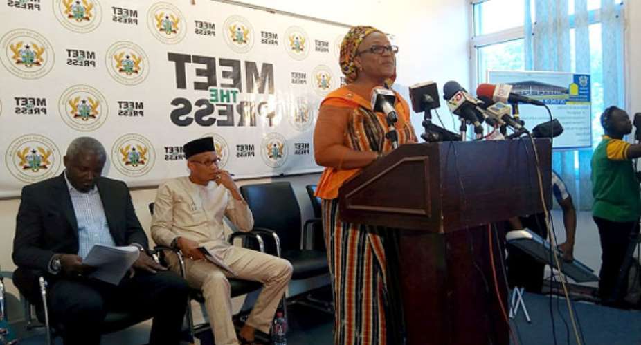 Afisa Otiko Djaba addressing the media. Seated behind her are Minister of Information 2nd right, Mustapha Hamid and his deputy, Perry Okudzeto