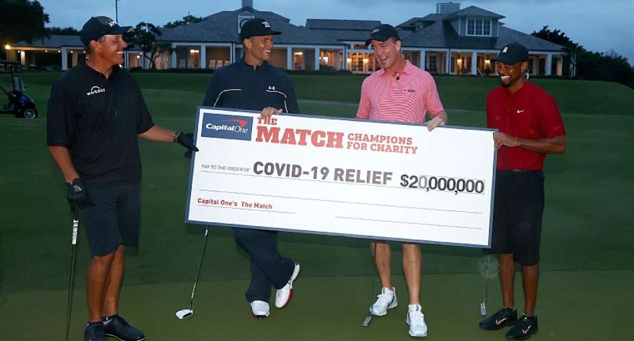 Photo caption:HOBE SOUND, FLORIDA - MAY 24: Tiger Woods and former NFL player Peyton Manning celebrate defeating Phil Mickelson and NFL player Tom Brady of the Tampa Bay Buccaneers on the 18th green during The Match: Champions For Charity at Medalist Golf Club on May 24, 2020 in Hobe Sound, Florida. Photo by Mike EhrmannGetty Images for The Match