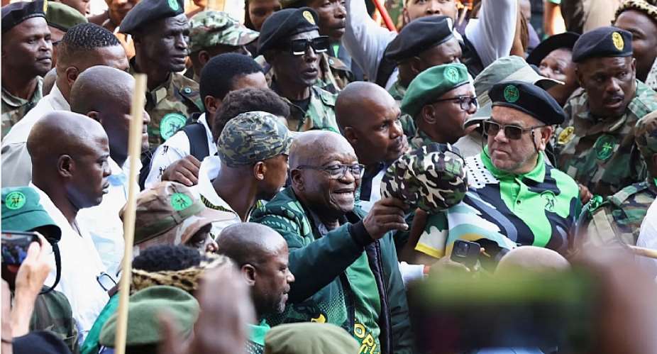 Former South African president Jacob Zuma arrives at a rally in Soweto on May 18, 2024, to launch the manifesto of his new political party, uMkhonto we Sizwe, ahead of South Africas May 29 general election. Men wearing military fatigues assaulted a number of journalists at the rally. (Reuters/Siphiwe Sibeko)
