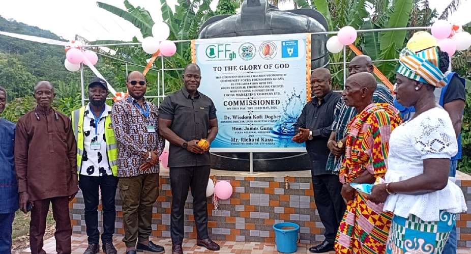 Volta Regional Minister, Hon James Gunu, the Managing Director of the Ghana Cocoa Marketing Company, Dr Wisdom Kofi Dogbey, Executive Director of CFF-Ghana, Mr Richard Kasu, the DCE for Ho West, Hon Prosper Francis Dussey and a Chief from Dodome-Dogblome in a photograph during the commissioning of the mechanised borehole at Dodome-Dogblome.