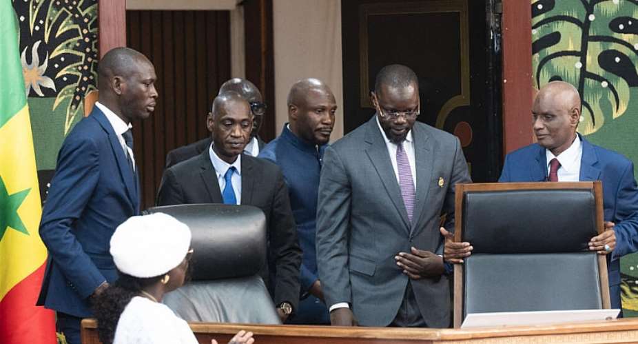 Former Senegal Prime Minister Ousmane Sonko (C) take his seat as Speaker of Senegal National Assembly on 26 May 2026, at the National Assembly in Dakar. Senegals National Assembly elected ousted prime minister Ousmane Sonko its speaker Tuesday in a vote boycotted by opposition, following months of tension that culminated last week in the firebrands sacking. - AFP - SEYLLOU
