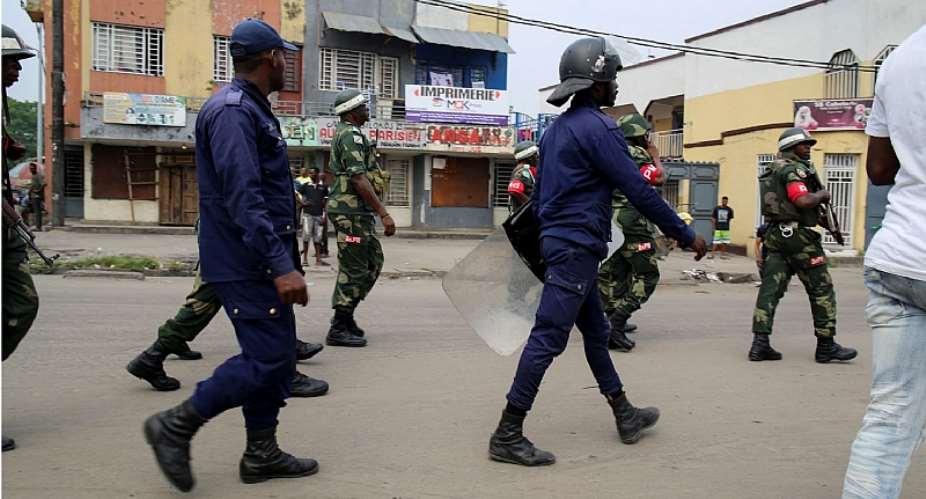 Security forces patrol during the clashes with antigovernment protesters in Kinshasa, Democratic Republic of Congo, on May 20, 2023. Demonstrators recently attacked journalist Geonne Djokwa. ReutersJustin Makangara