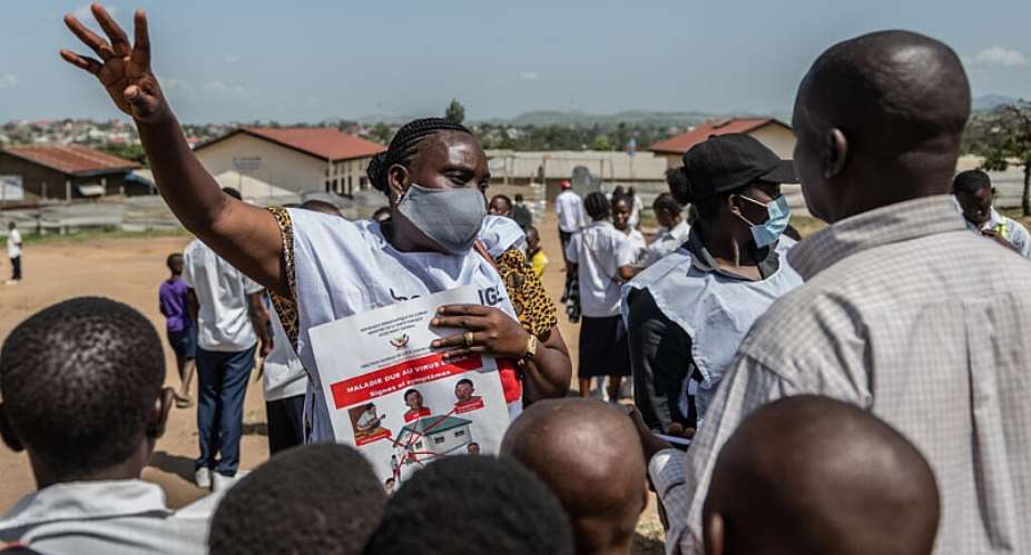 A Red Cross volunteer speaks to people during a public awareness campaign in Bunia, DRC, where the current outbreak began on 15 May. -  AP Photo / Moses Sawasawa