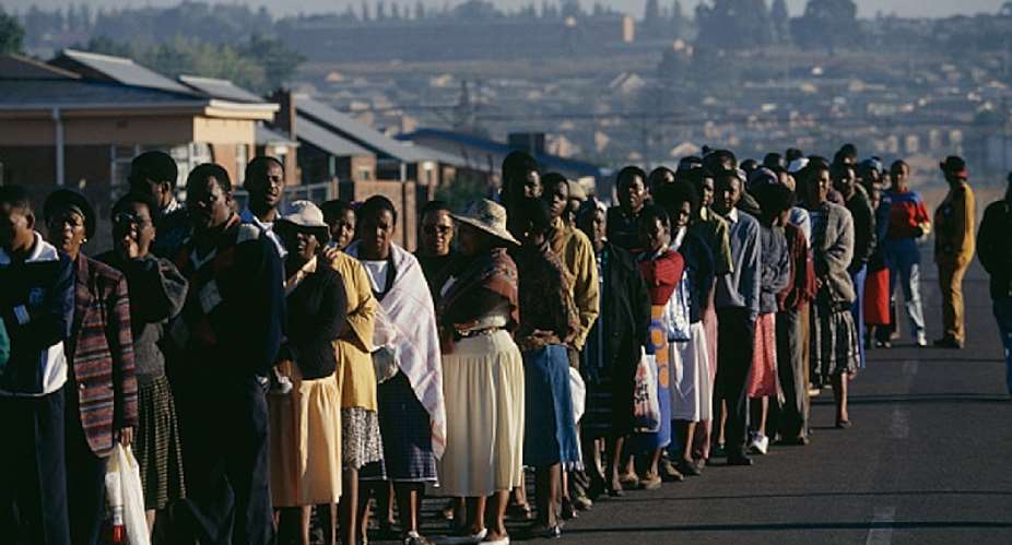 Hundreds of people stand in line to vote in  South Africaamp;39;s first democratic election in April 1994.  - Source: Brooks Kraft LLCSygma via Getty Images