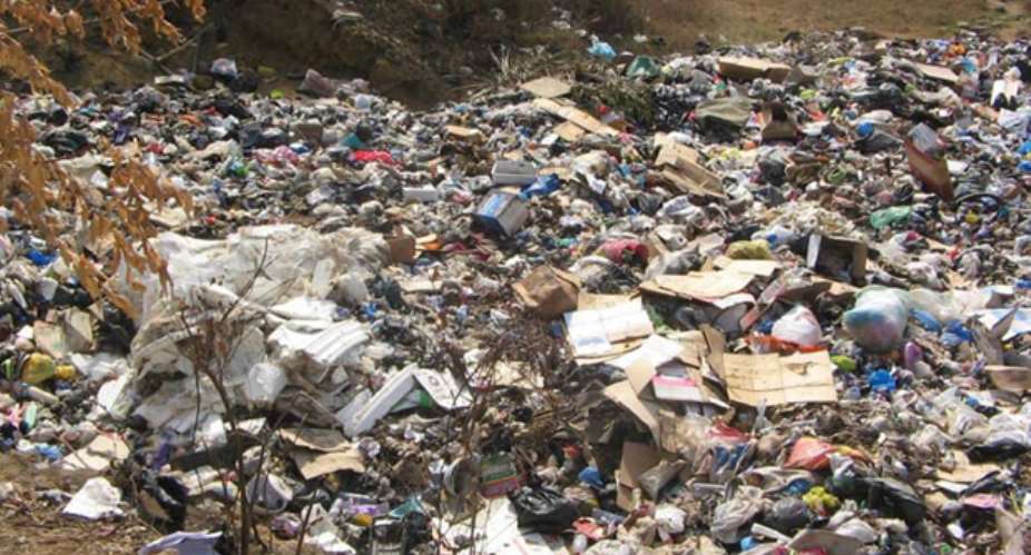 A refuse dump along the bank of the Densu River