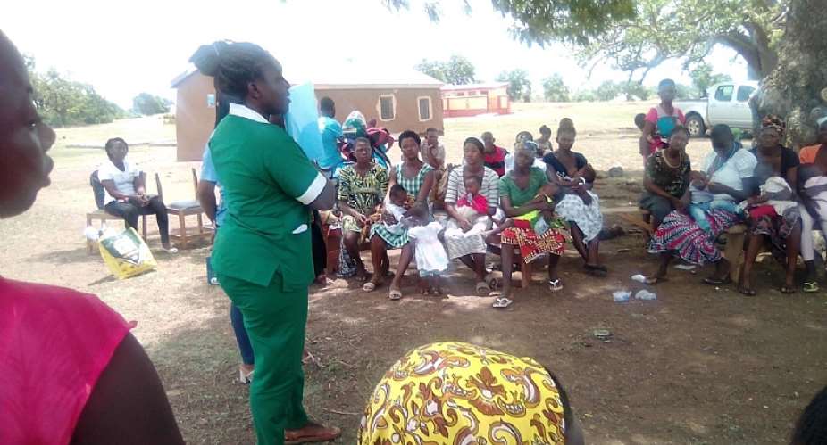 Community members being schooled  on Sexual Reproductive Health on the Menstrual Hygiene Day held in communities in UER