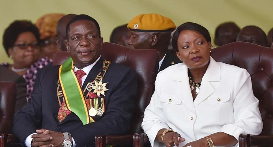 Zimbabwean President Emmerson Mnangagwa sits with First Lady Auxillia Mnangagwa in Harare on November 24, 2017. The first lady's staff recently blocked several journalists from covering her events. AFP/Tony Karumba)