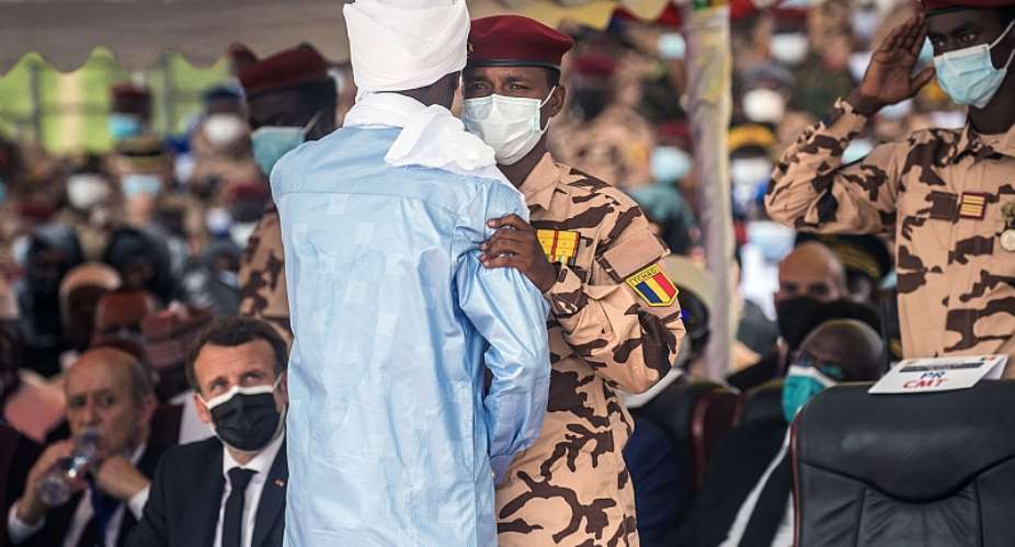Mahamat Idriss Deby, right, greets his brother Zakaria during the state funeral for their father Chadian President Idriss Deby.  - Source: Christophe PetitAFP via Getty Images