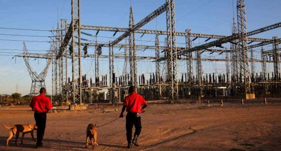 Security guards arrive for their shift at a power station outside Gaborone, Botswana, on November 23, 2015. Journalists in Botswana said they will remain vigilant after the passage of a new surveillance law in February 2022. ReutersSiphiwe Sibeko