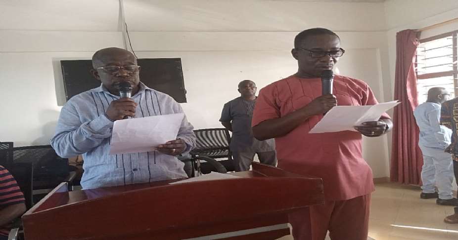 Ashanti Regional Minister, Hon. Simon Osei Mensah swearing in the DCE elect