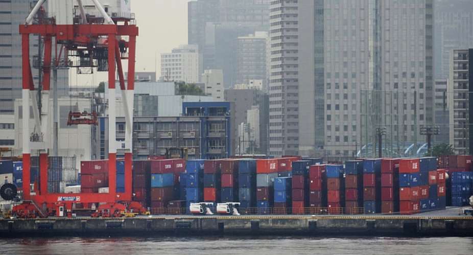 Shipping containers sit stacked at a port in Tokyo as G7 trade ministers meet in Paris amid rising global trade tensions, tariff threats and concerns over supply chains. - AP - Koji Sasahara