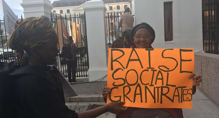 Social grant recipients rally outside parliament in Cape Town calling for increases to grant rates in 2017.  - Source: Photo by Christopher Webb
