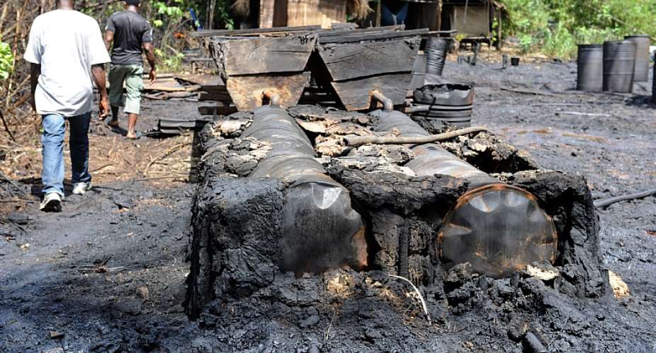 Illegal oil refineries are operated by oil thieves in the Niger Delta region of Nigeria.  - Source: Pius Utomi EkpeiAFP via Getty Images