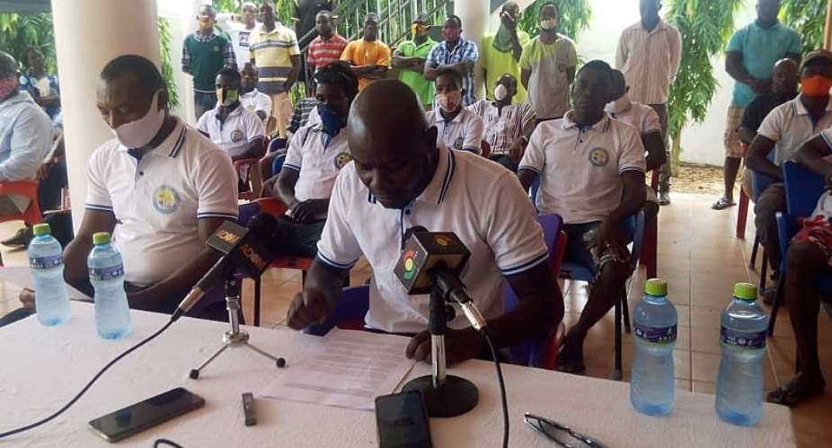 Harrison Noye Quarshie, Assistant Secretary of the Youth Association with the microphone addressing the press