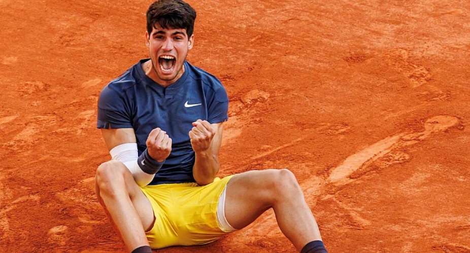 GETTY IMAGESImage caption: Carlos Alcaraz is the youngest man to win Grand Slam titles on three different surfaces