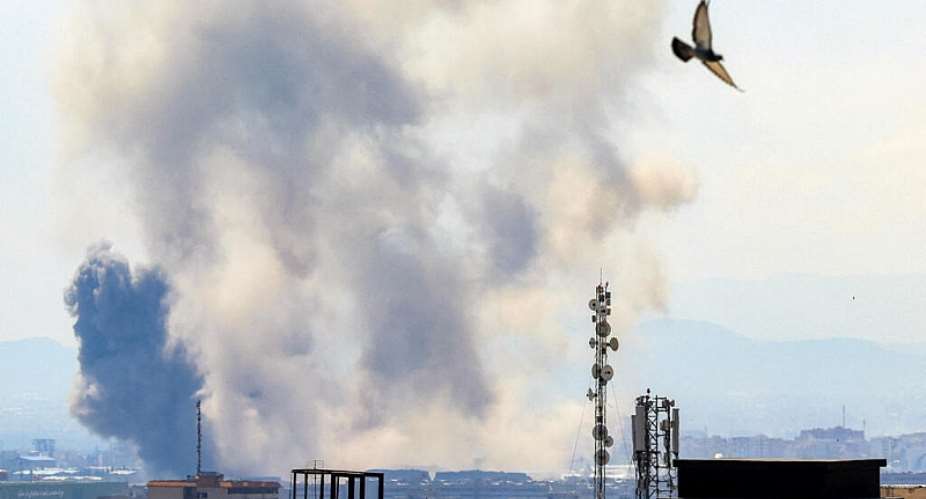 Smoke rises following strikes on Tehran on April 7, 2026 -  Atta Kenare, AFP