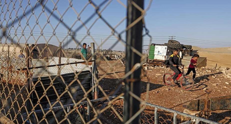 Palestinian children play in the Bedouin community of Dar Abu Faza, on the outskirts of the Israeli-occupied West Bank village of Taybeh, on 9 June 2026. - AFP - ZAIN JAAFAR