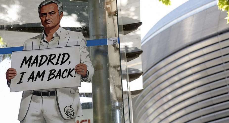 A mural by Italian urban artist Salvatore Benintende aka TV BOY depicting Portuguese coach Jose Mourinho is seen in front of the Santiago Bernabeu stadium in Madrid on May 21, 2026. -  Oscar del Pozo, AFP