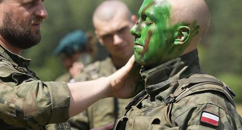 Volunteers in Polands army learn to apply camouflage face paint during basic training in Nowogrod, Poland, June 20, 2024. -  Czarek Sokolowski, AP