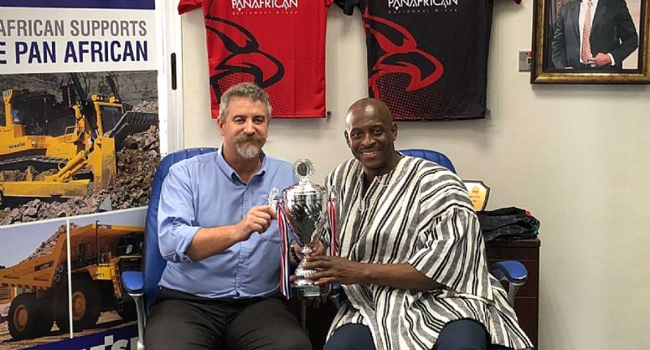 Mr Herbert Mensah, President and Board Chairman of the Union, shares the 2018 Rugby Africa Bronze Cup with Mr Tim Callaghan, General Manager of the Panafrican Equipment Group. Panafrican built and donated two scrum machines to Ghana Rugby
