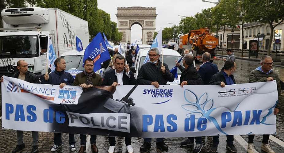 French police protest on Champs-Elyses against allegations of violence, racism