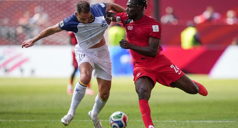 Bosnia-Herzegovinas Nikola Katic (18) and Canadas Promise Akinpelu (24) vie for the ball during the second half of the World Cup Group B soccer match between Canada and Bosnia, Friday, June 12, 2026, in Toronto. -  Nathan Denette, AP
