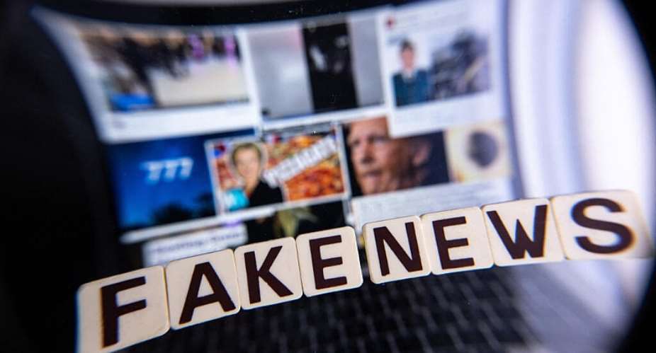 This illustration photograph shows letters reading fake news seen through a magnifying glass, against a laptop screen displaying other illustration images of various alleged fake news. -  AFP, Sebastien Bozon