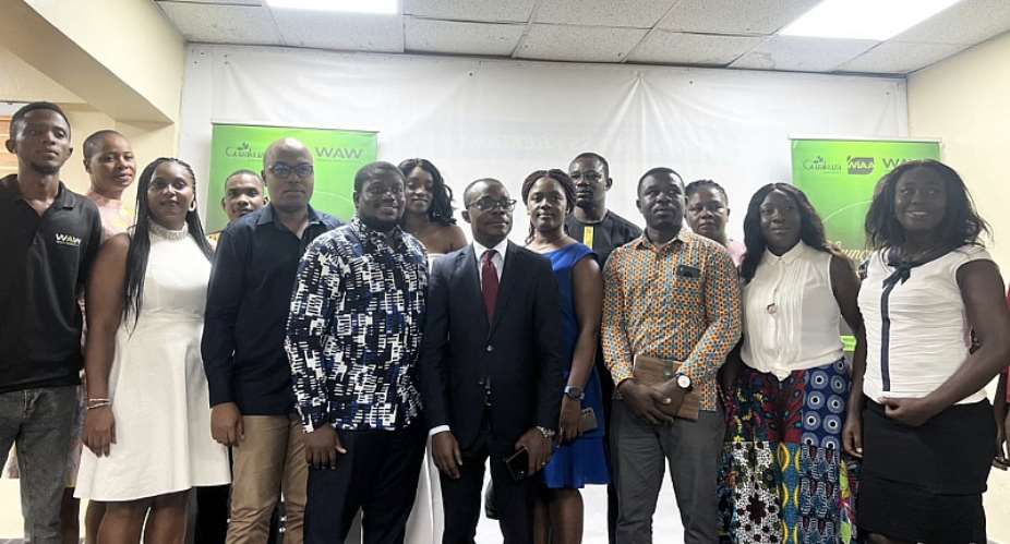 A group photograph of Guzakuza staff and sponsors after the launch