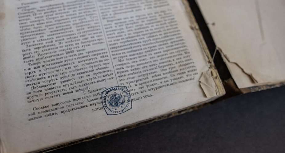 The fake copy of a 1802 book -- the title page is copied and pasted into another 19th century book without any value and the stamps are fake - is pictured at the University of Warsaw library in Warsaw, Poland on November 14, 2023. A spate of thefts of rare Russian classics worth millions of euros from libraries across Eastern Europe has left a trail that points all the way to Moscow. - AFP - WOJTEK RADWANSKI