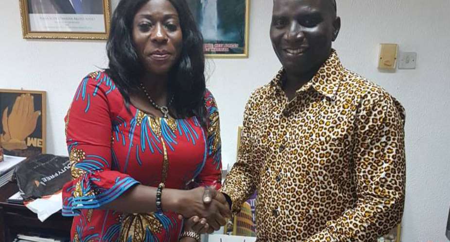 Catherine Afeku giving and appointment letter to Socrate Safo.