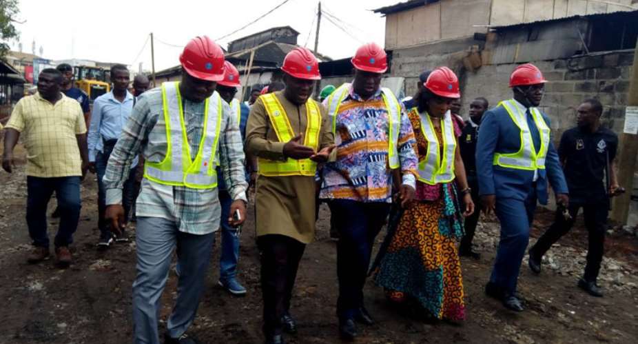Joe Ghartey touring the tracks with the Mayor, Madam. Sackey, the Committee Members and some security personnel.