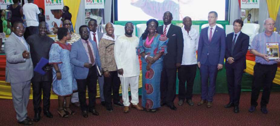 Gifty Twum Ampofo middle with COTVET executive and other dignitaries