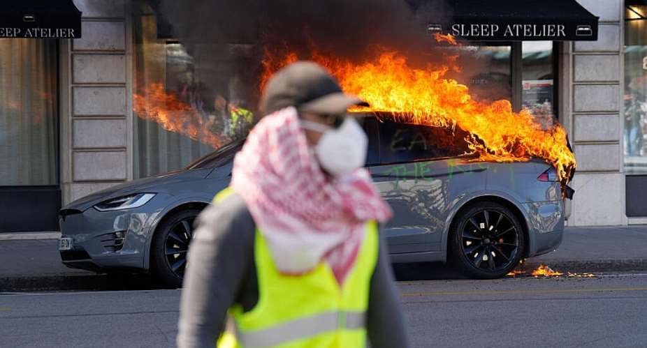 A car burns during a No G7 demonstration in Geneva, Switzerland, Sunday, June 14, 2026, ahead of the G7 summit scheduled to take place June 15-17. - AP Photo/Baz Ratner - Baz Ratner