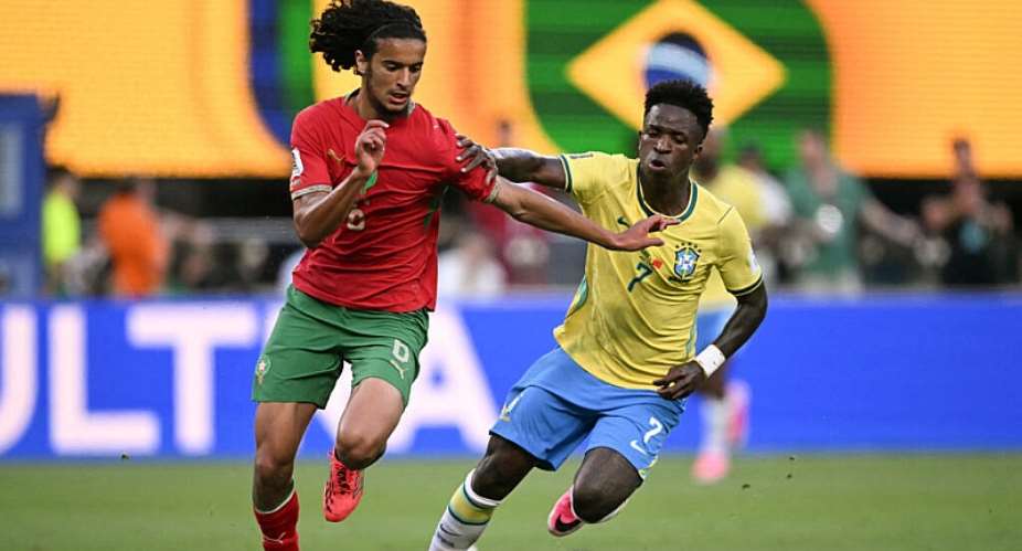 Moroccos midfielder Ayyoub Bouaddi and Brazils Vinicius Junior fight for the ball during the 2026 World Cup Group C football match, June 13, 2026. -  Mauro Pimentel, AFP