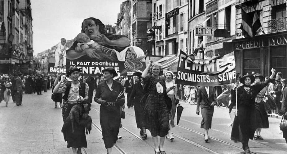 Women march in a Bastille Day rally in Paris on 14 July, 1936 celebrating labour reforms introduced by Frances Popular Front government. -  AFP