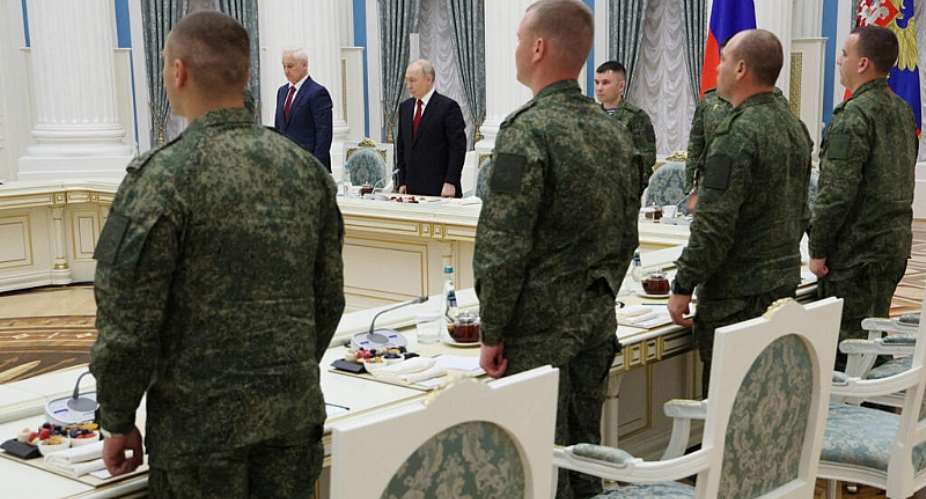 Russias President Vladimir Putin and Defence Minister Andrei Belousov observe a minute of silence following an award ceremony marking Russia Day national holiday at the Kremlin in Moscow on June 12, 2026. -  Vyacheslav Prokofyev, Reuters