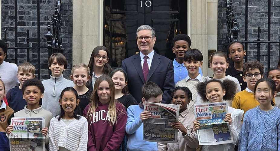 UK Prime Minister Keir Starmer surrounded by children