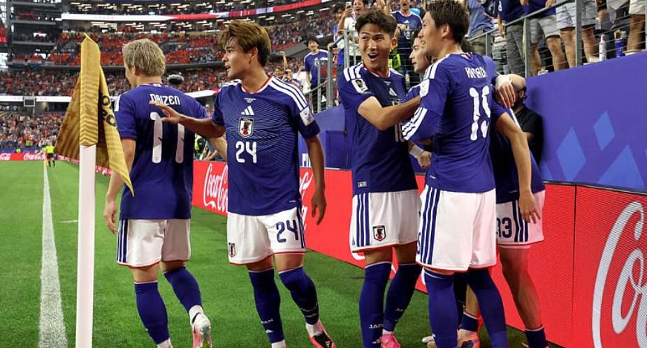 Keito Nakamura #13 of Japan celebrates with teammates after scoring the teams first goal during the FIFA World Cup 2026 Group F match between Netherlands and Japan at Dallas Stadium on June 14, 2026 in Arlington, Texas. -  Charlotte Wilson, Getty Images via AFP