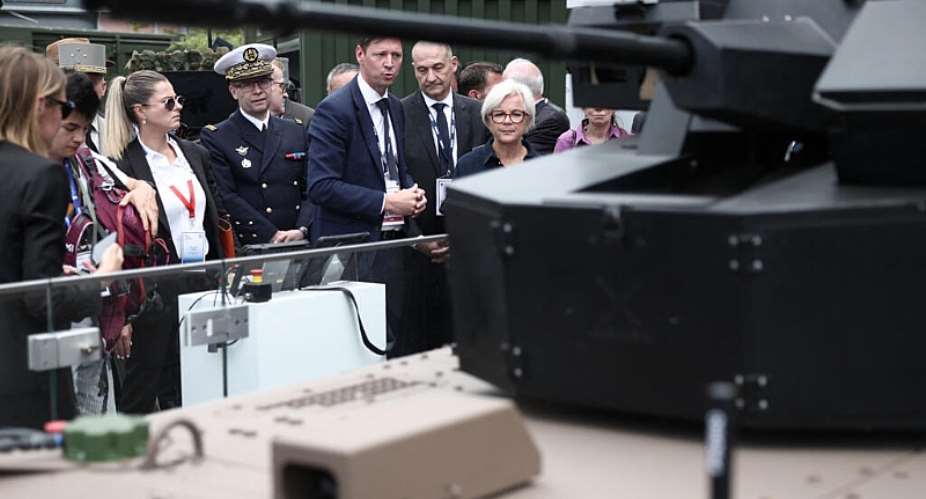 Frances Defence Minister Catherine Vautrin (R) listens to KNDS CEO Nicolas Groult (C) at the KNDS stand at the Eurosatory land and airland defence and security trade fair near Paris on June 15, 2026. -  Guillaume Baptiste, AFP