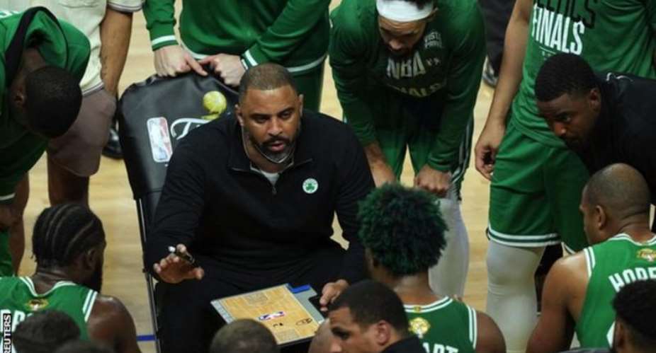 Ime Udoka seated was appointed by Boston Celtics last June after nine years in the NBA as an assistant coach