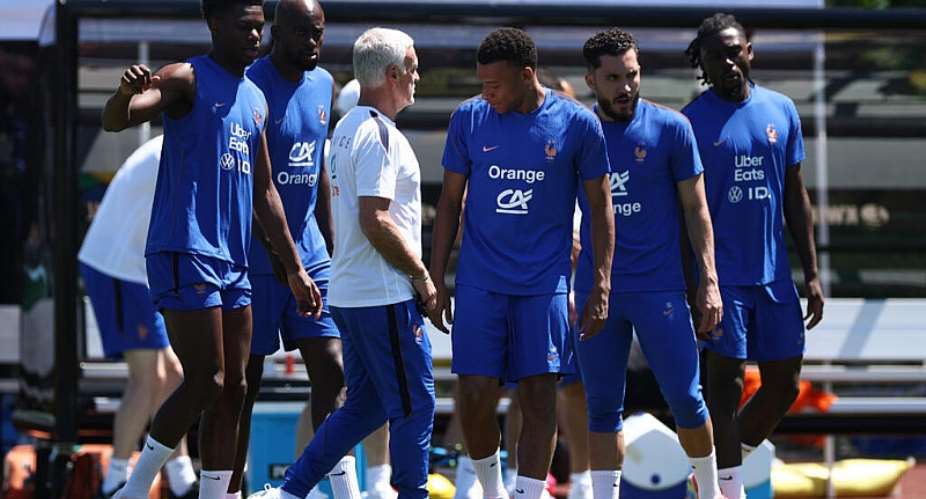 Kylian Mbappe and his France teammates training at their base near Boston on Sunday, with coach Didier Deschamps in white -  FRANCK FIFE / AFP