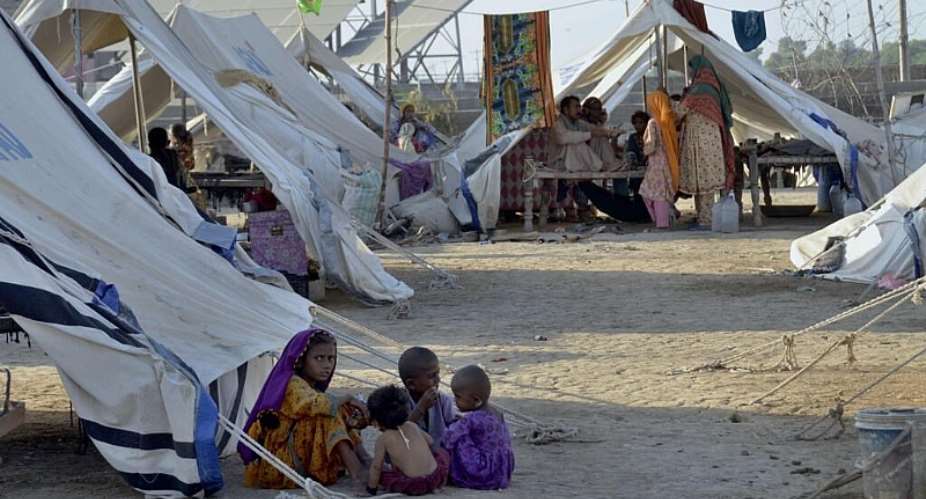 Children displaced by floods play in a relief camp, in Jaffarabad, a district in the southwestern Baluchistan province, Pakistan, 2022. -  Zahid Hussain / AP