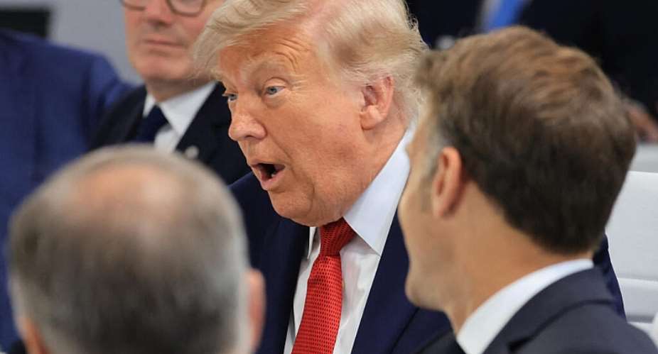 US President Donald Trump and Frances President Emmanuel Macron attend a morning work meeting to revive balanced, inclusive, and sustainable economic growth for the benefit of all in the presence of the G7 countries, partner countries, the International Monetary Fund, and the OECD, as part of the G7 summit, in Evian, eastern France, on 17 June 2026. - AFP - LUDOVIC MARIN